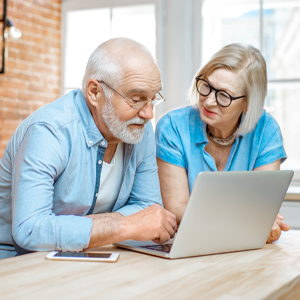 Older couple looking at a laptop